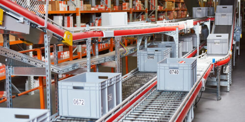 Automated,Warehouse.,Boxes,With,Spare,Parts,Moving,On,Conveyer