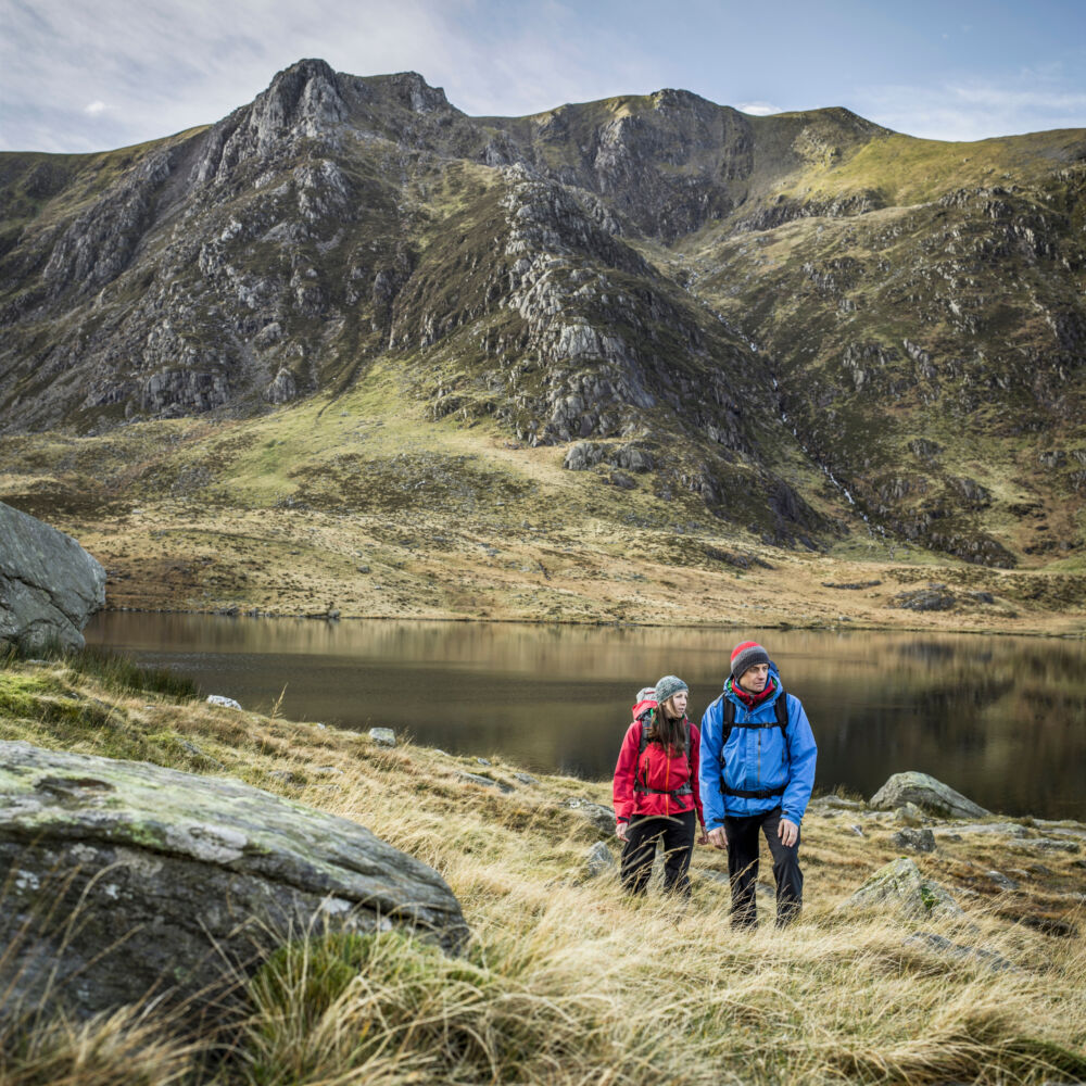 Couple hiking in rocky landscape